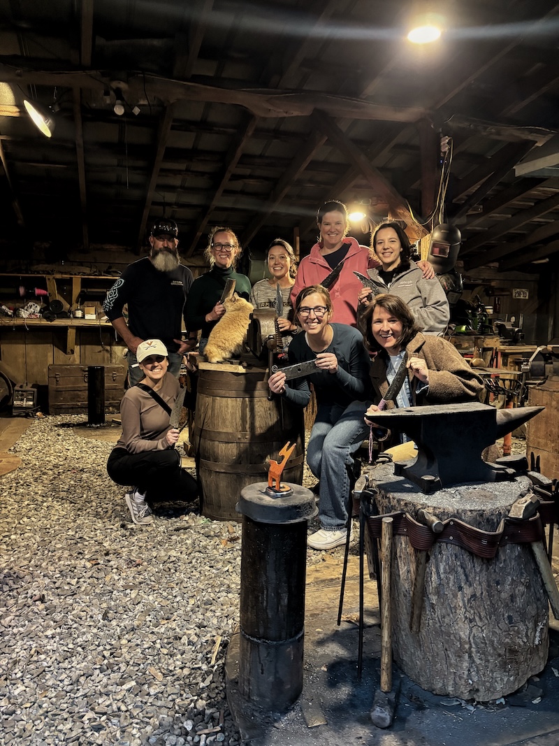 Group of women displaying finished blades at The Forge near Asheville NC